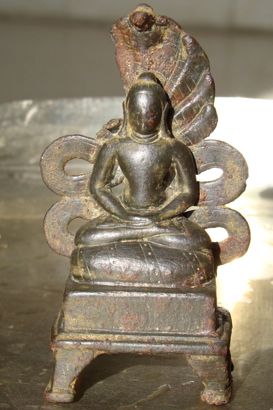 Ancient metal image of Bhagwan Parshvanath with serpent hood