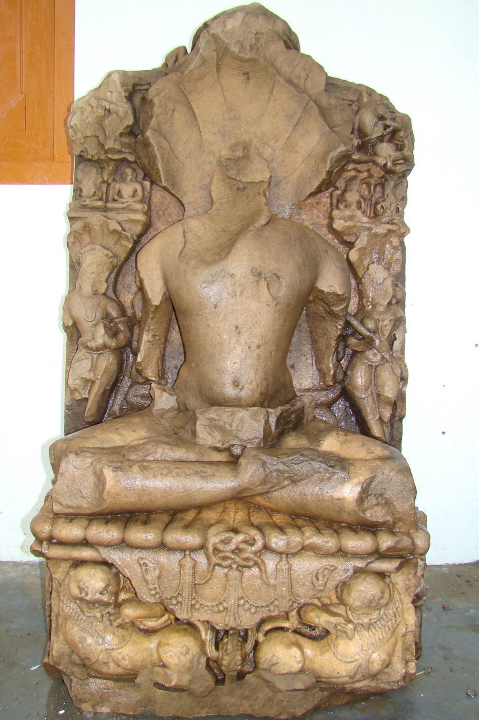 Ancient stone sculpture of Bhagwan Parshvanath with serpent canopy, recovered from the durg